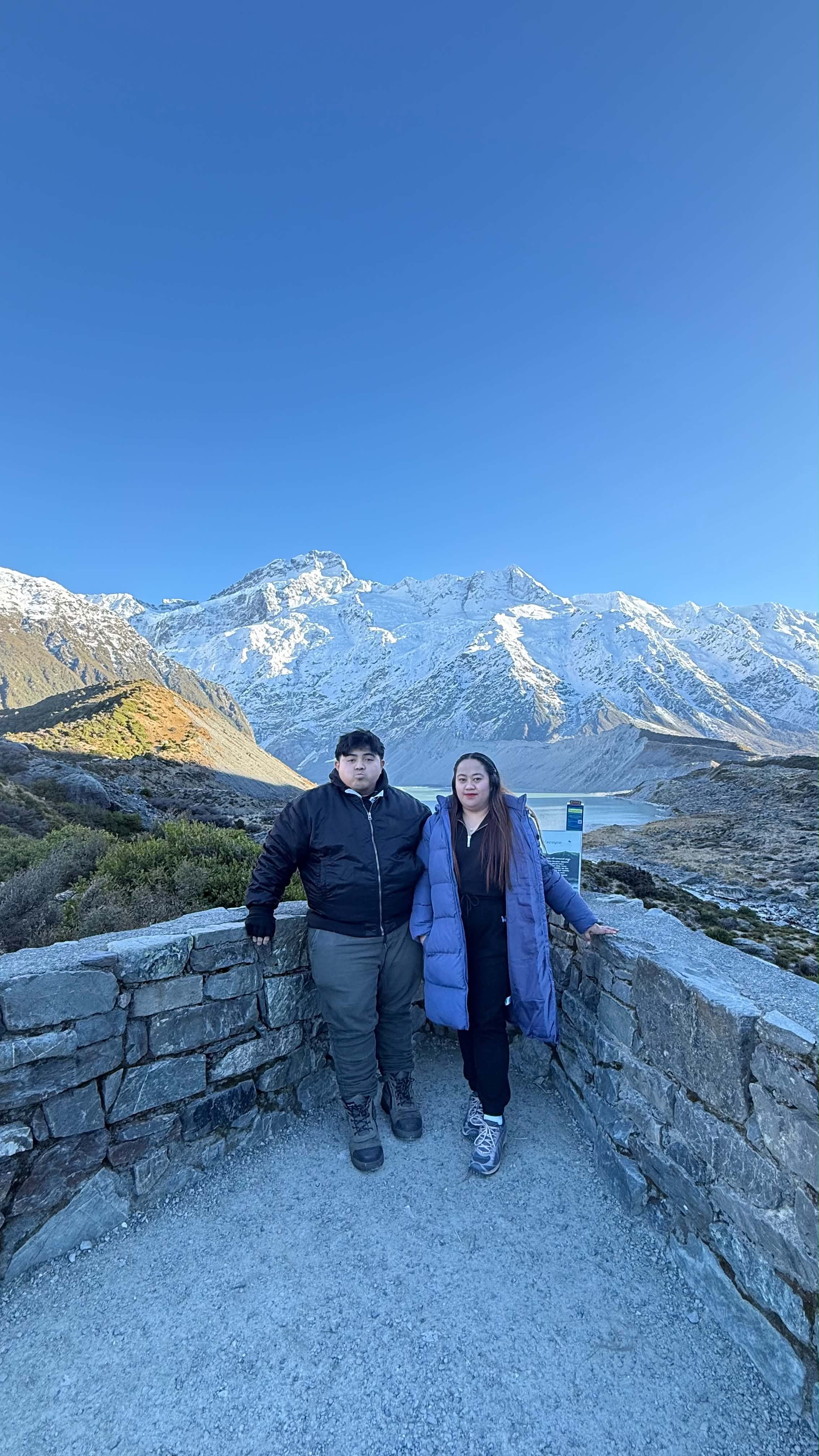 Jhon Aries and Charmnie Jade in front of snowy mountains